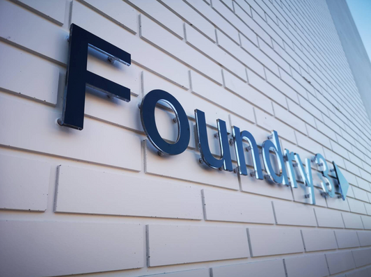 Custom acrylic letters signage by Retail Sign, featuring modern, clear acrylic letter design on a neutral background.