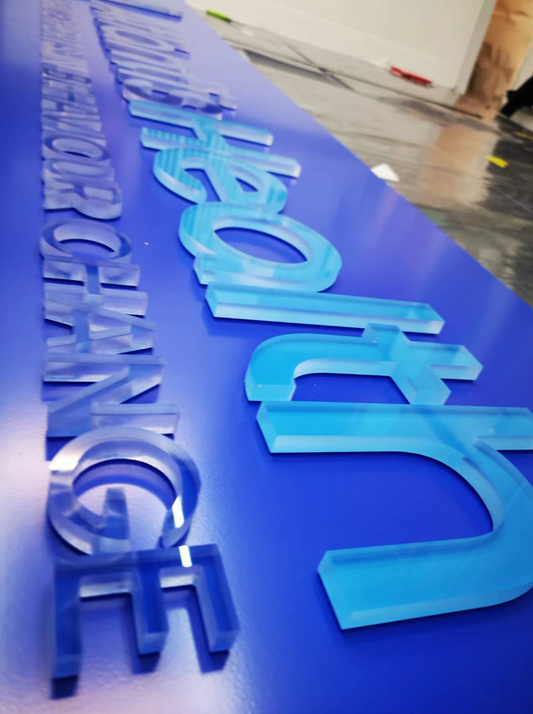 Clear acrylic letters spelling "Retail Sign" for custom signage, mounted on a white background.