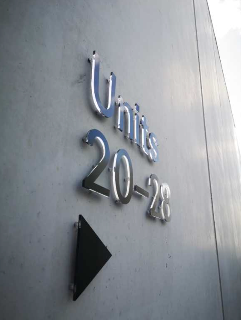 Custom acrylic letters signage with bold, clear lettering in various sizes, designed by Retail Sign for modern branding.