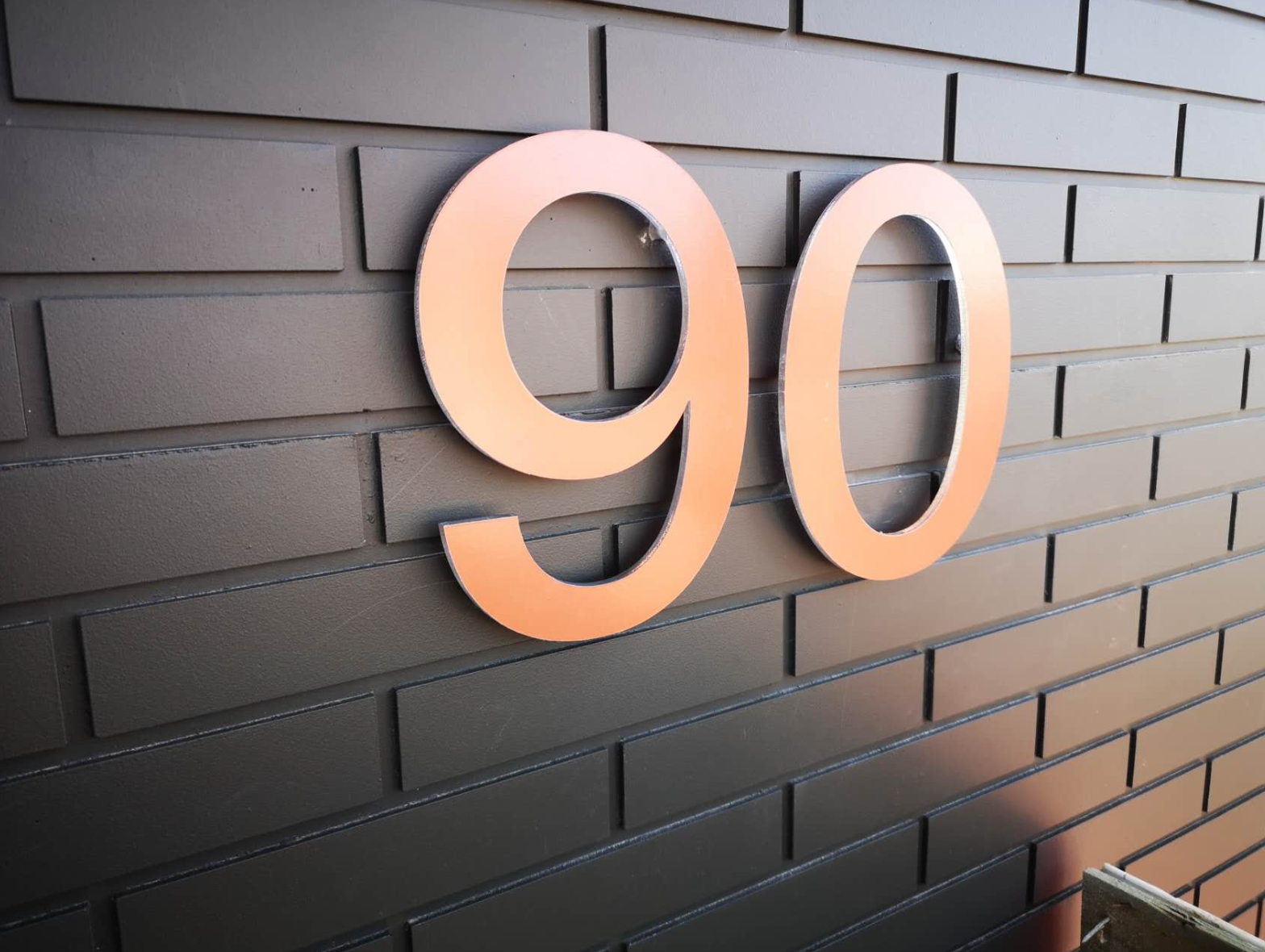 Custom acrylic letters and numbers signage by Retail Sign, showcasing bold, clear lettering on a sleek acrylic background.