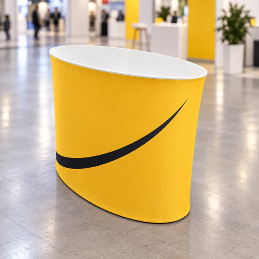 Yellow oval fabric exhibition counter by Retail Sign, portable display with a large oval shape and fabric surface.