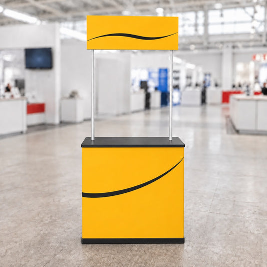 Straight-sided portable promotion counter with overhead header, yellow front view