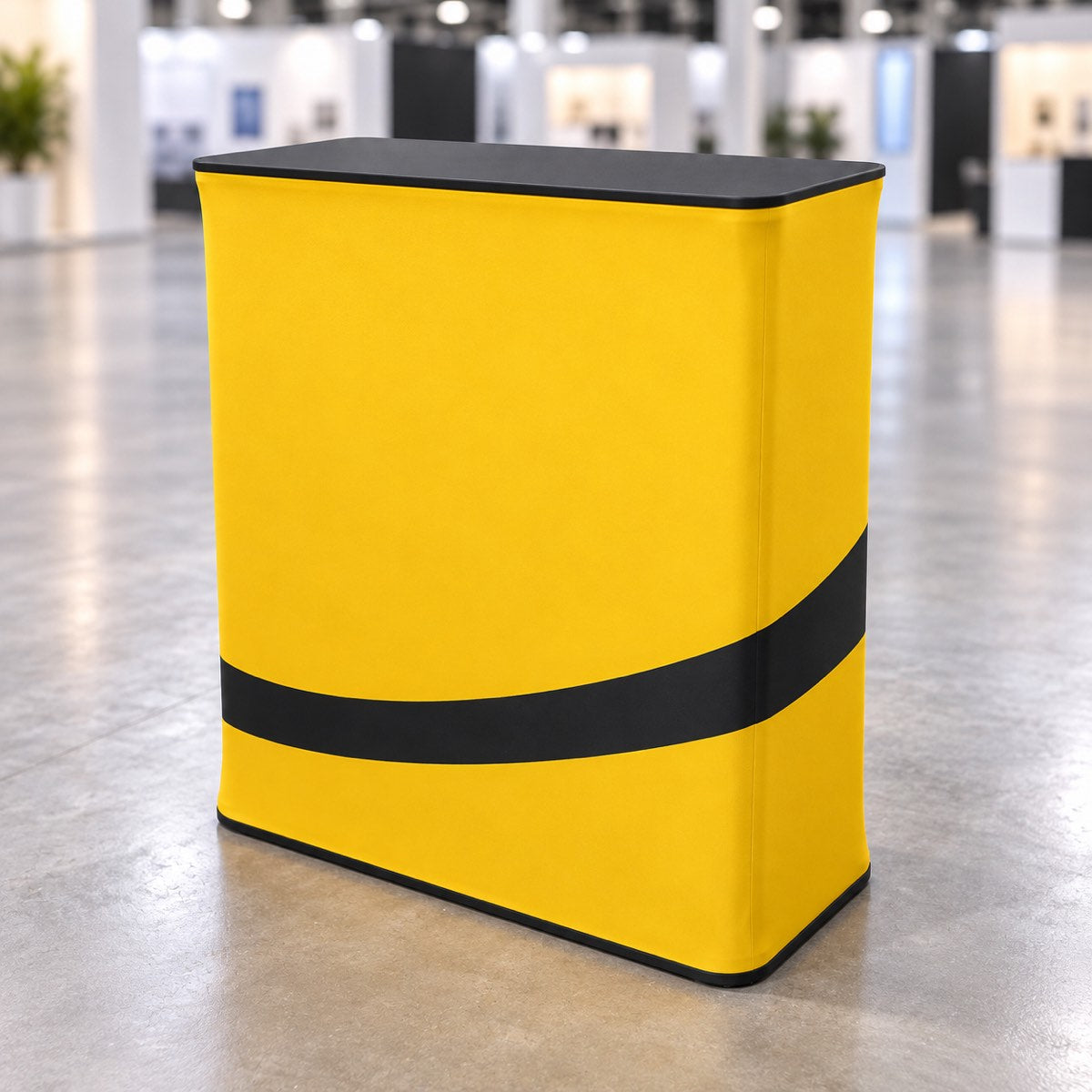 Square fabric exhibition counter with black tabletop and yellow printed wrap — illustrative mockup